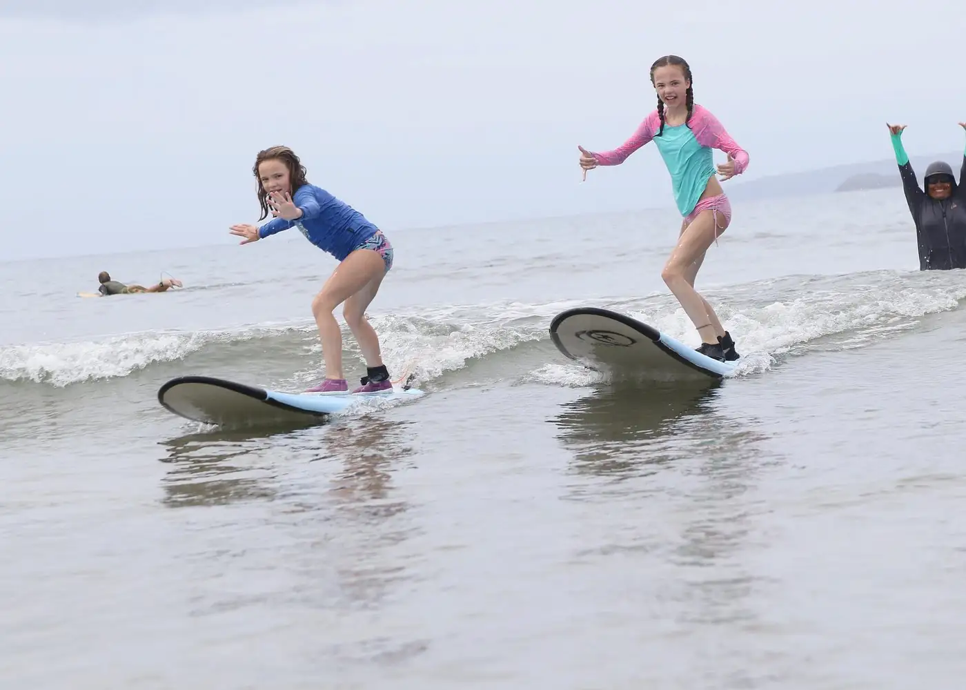 Small group surf lessons Tamarindo 2-3 students on beach