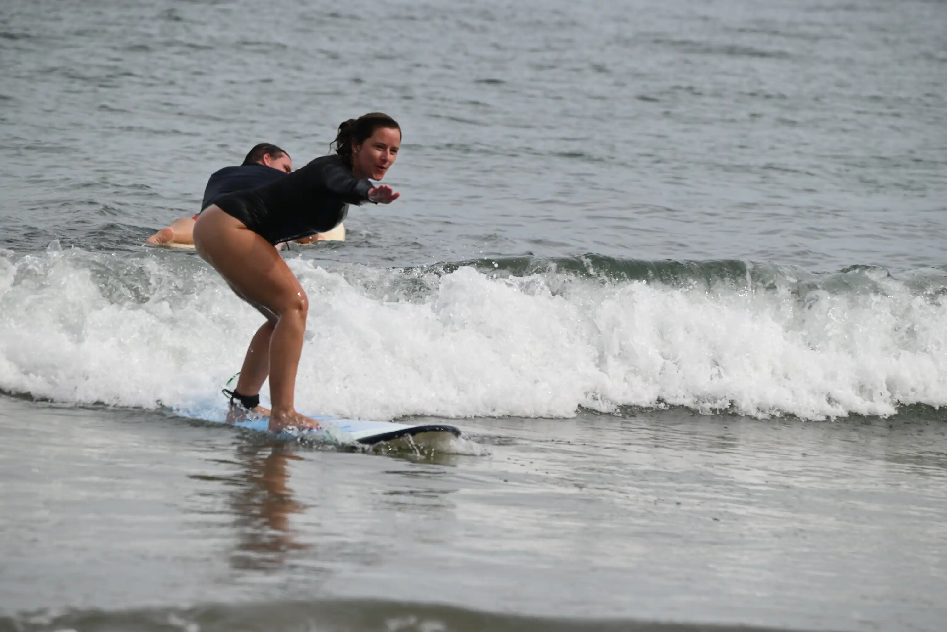Pura Vida Surf School instructor guiding students on a surf trip in Guanacaste