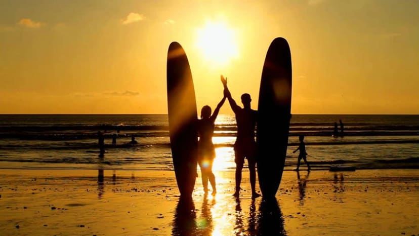 Group of surf students in the water at Tamarindo, Costa Rica