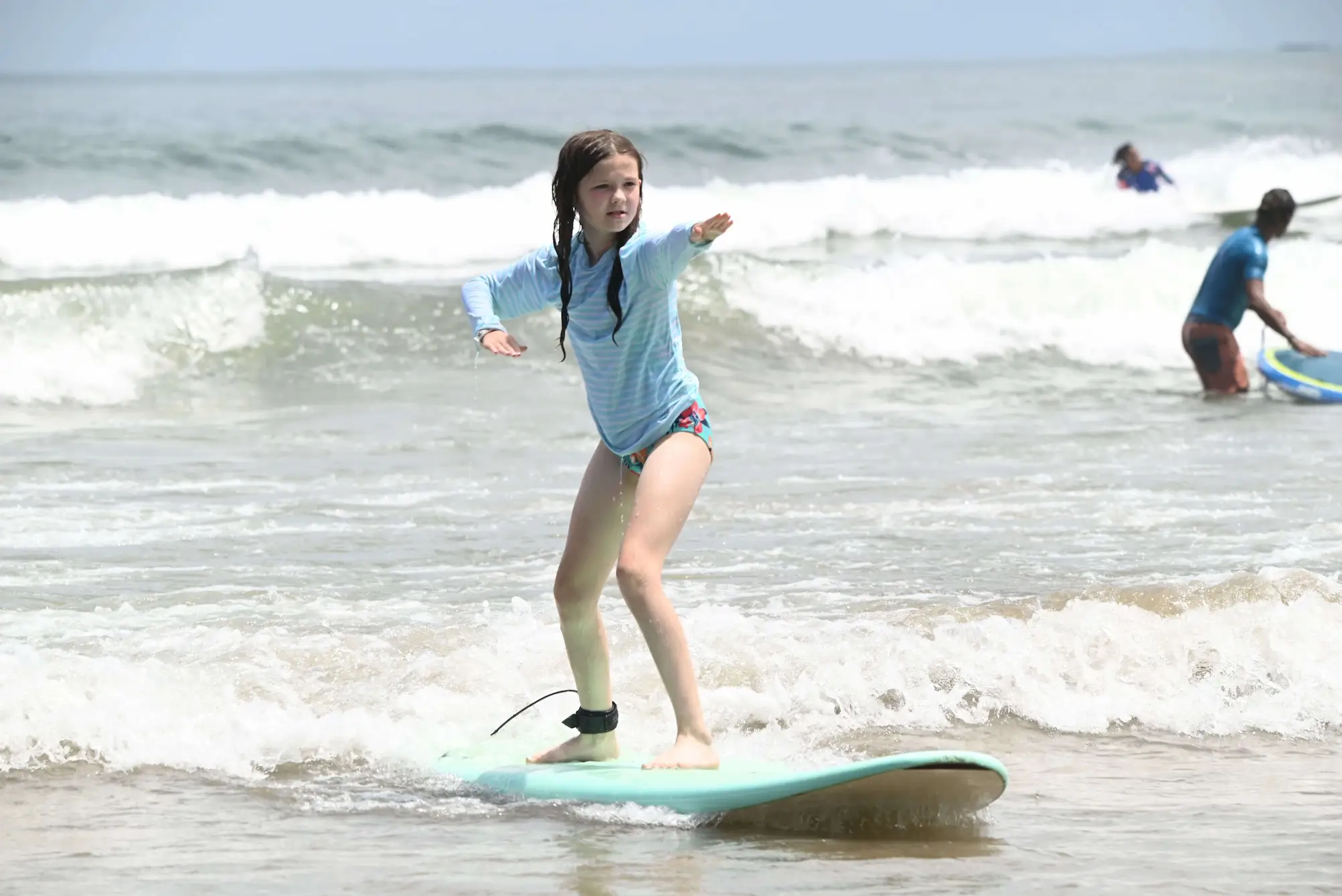 Pura Vida Surf School instructor with a student at Tamarindo Beach