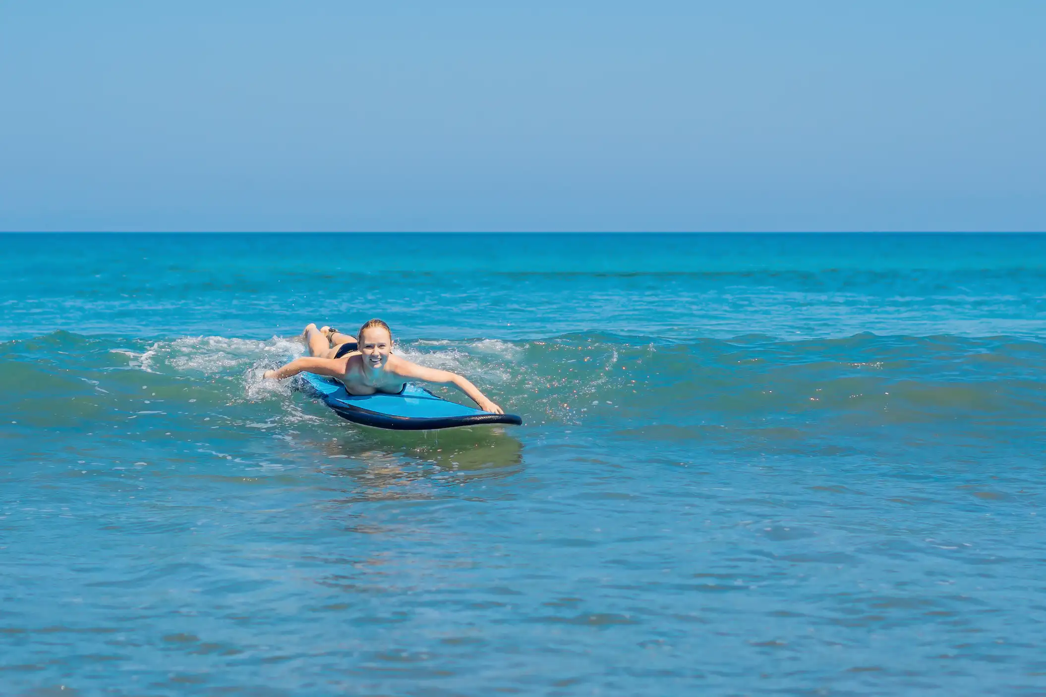 Semi-private surf class Tamarindo couple riding wave together