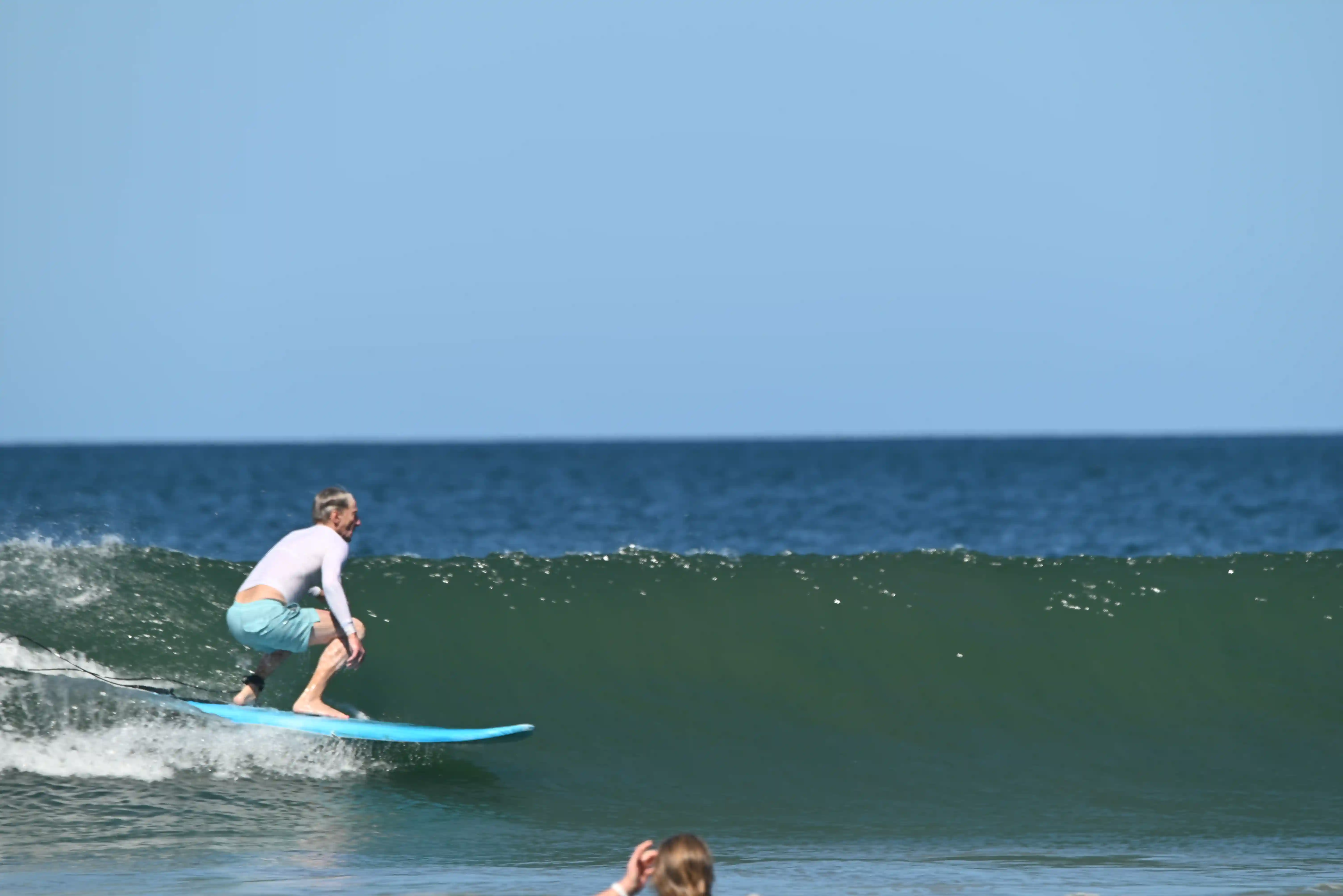 Surf camp one week Tamarindo — student catching first green wave